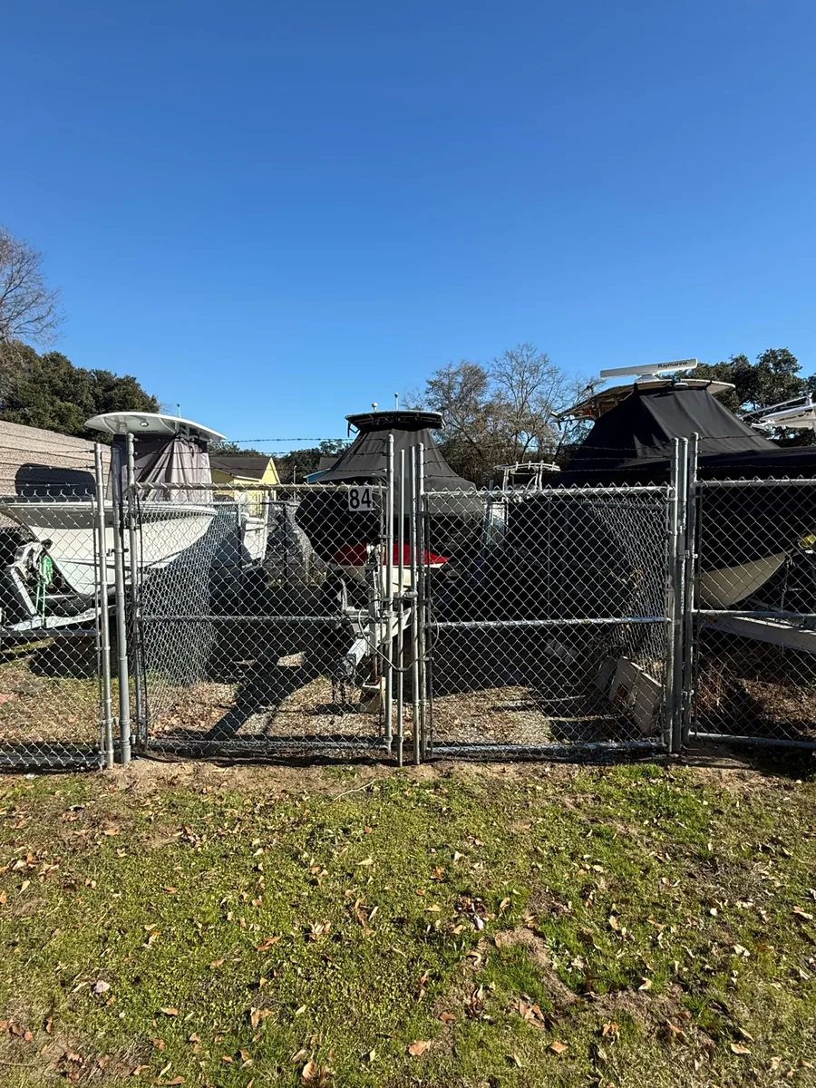 Boats stored behind individual gates near space 84